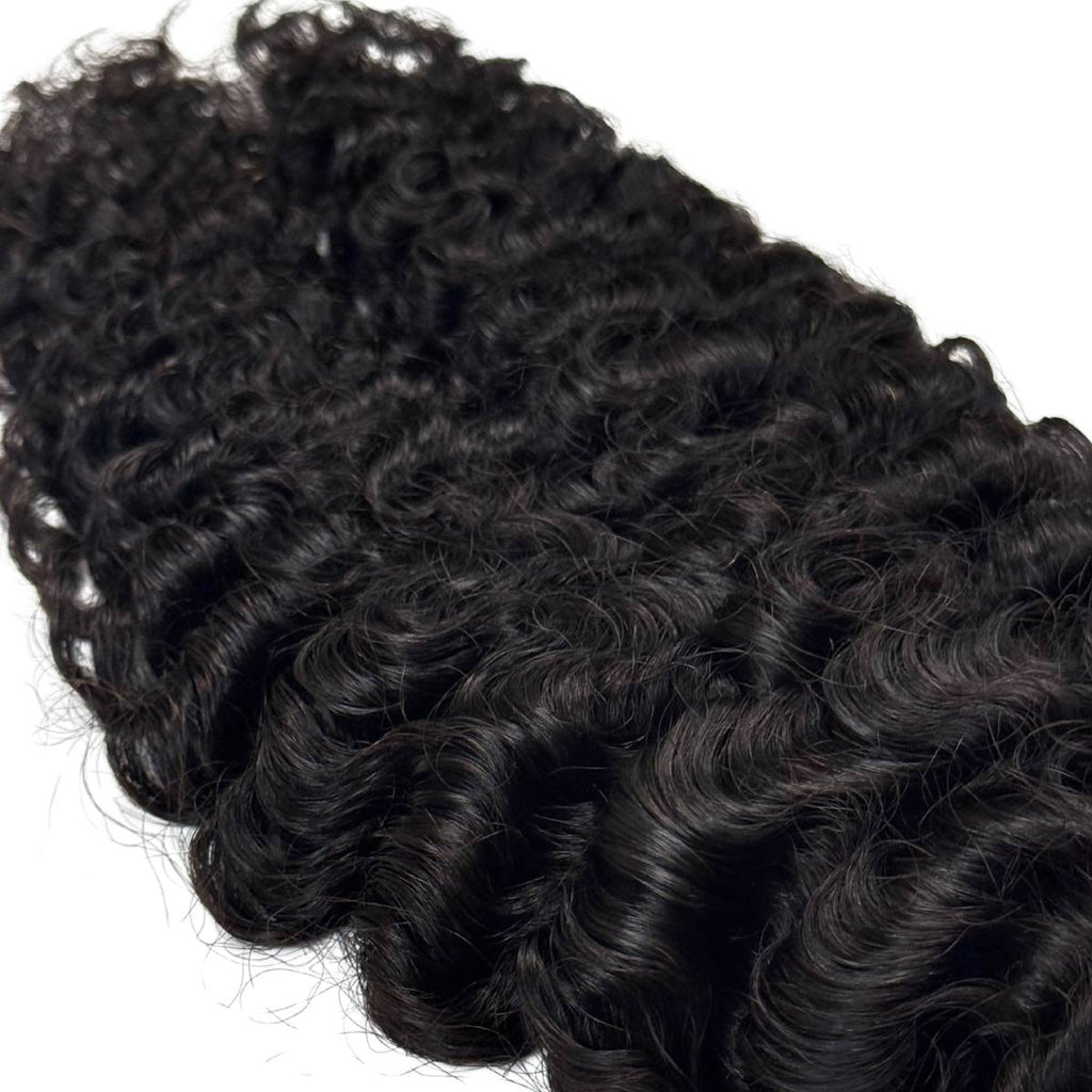 Curly black hair extensions on a white background