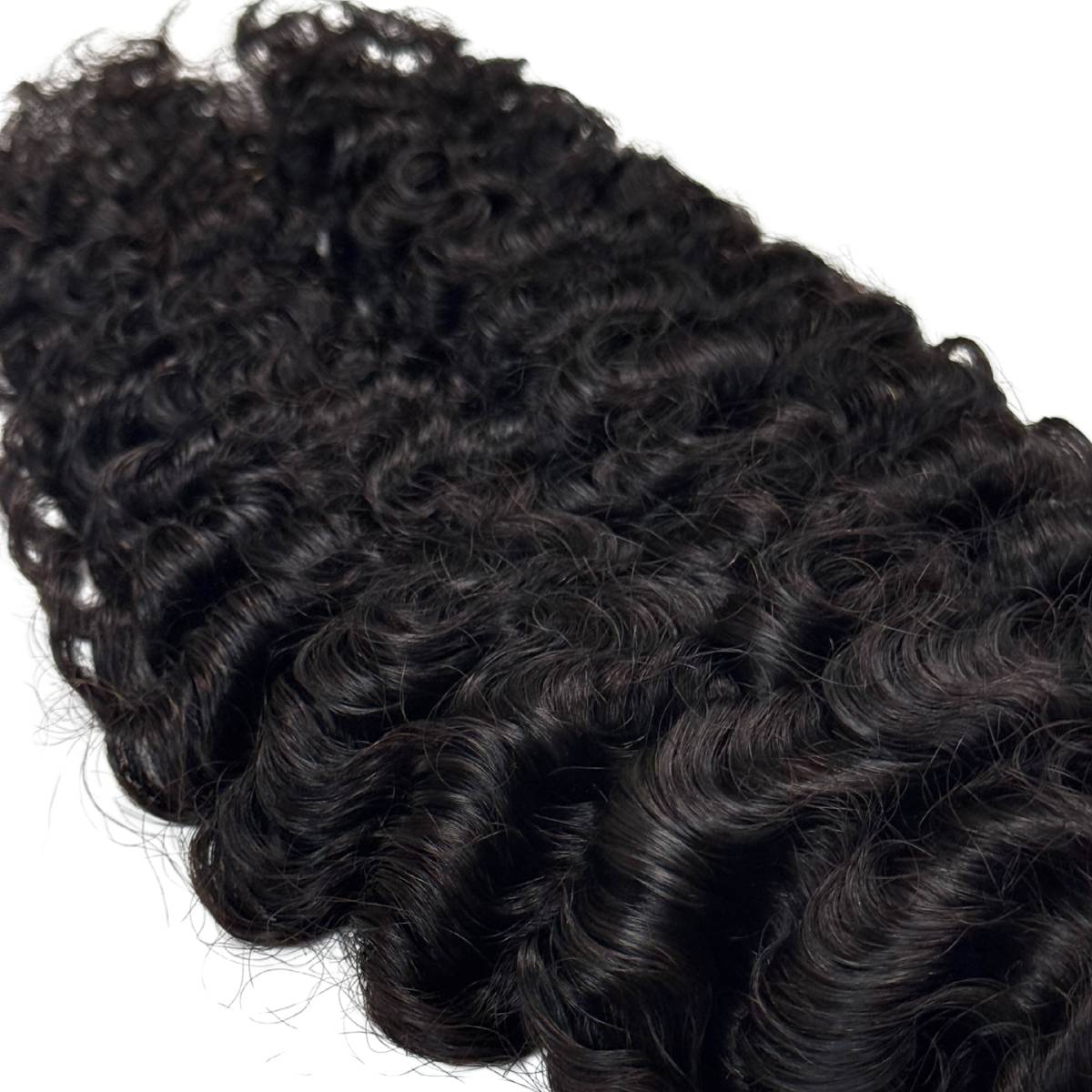 Curly black hair extensions on a white background